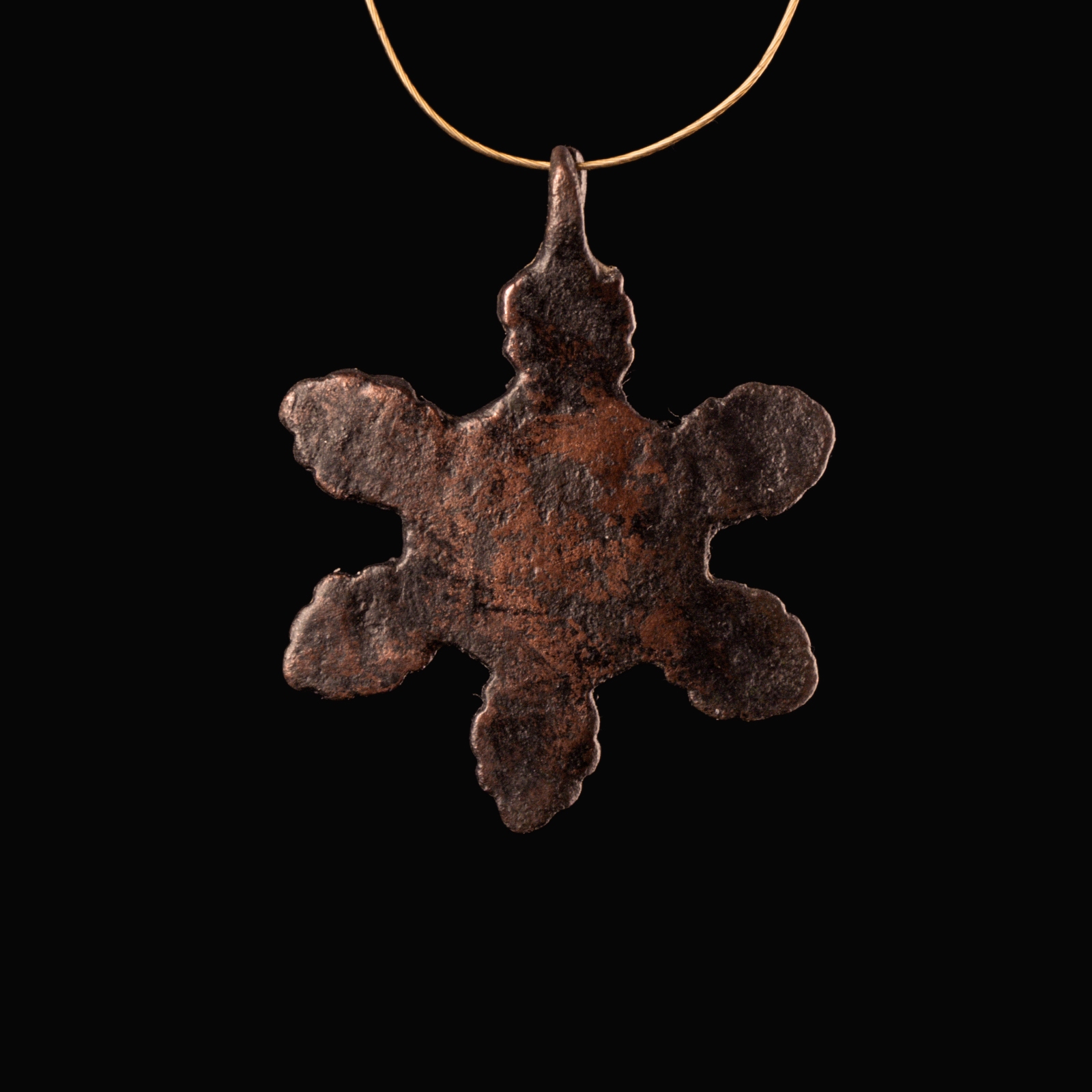 Medieval bronze harness pendant with central bust