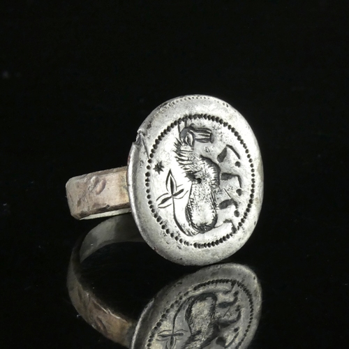 Medieval silver seal ring with a horse