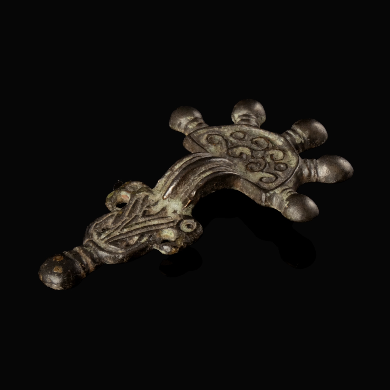 Migration Period, Merovingian silver radiate-headed brooch with bird-heads