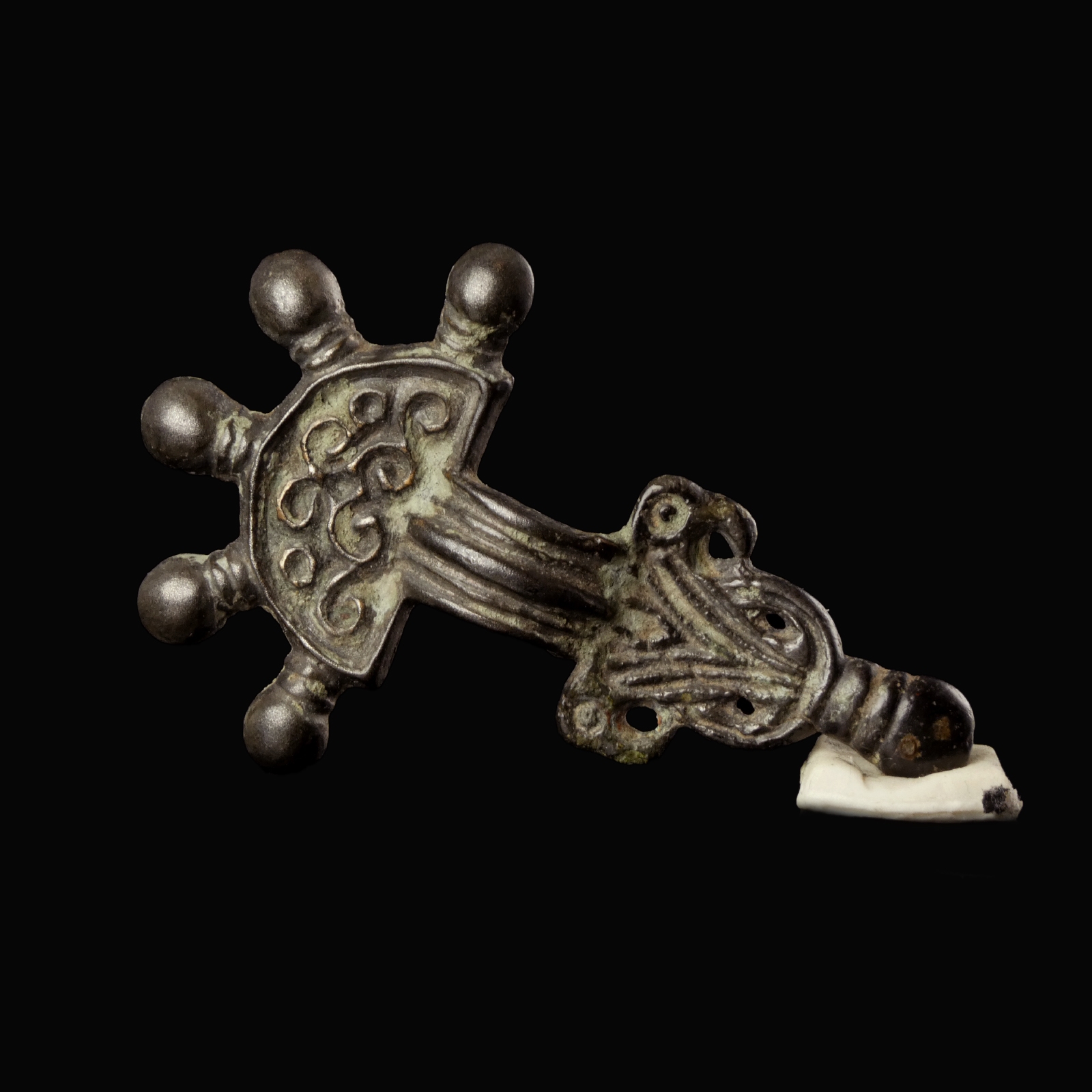Migration Period, Merovingian silver radiate-headed brooch with bird-heads