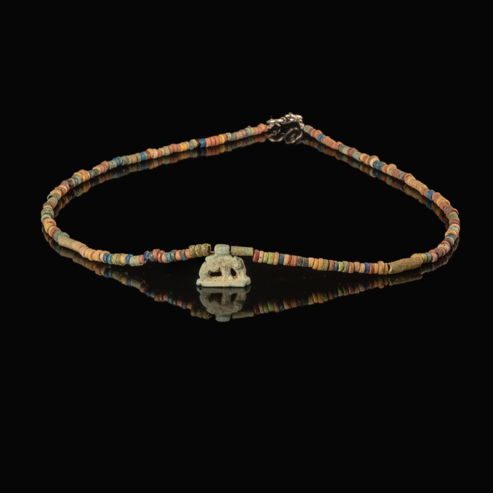 Necklace with ancient Egyptian multicoloured faience beads with a Goddess Nut as a sow amulet
