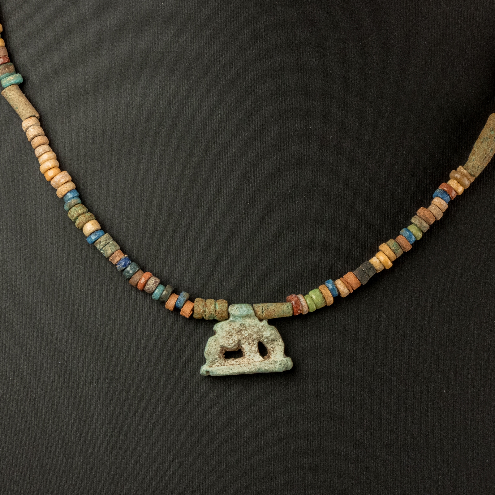 Necklace with ancient Egyptian multicoloured faience beads with a Goddess Nut as a sow amulet