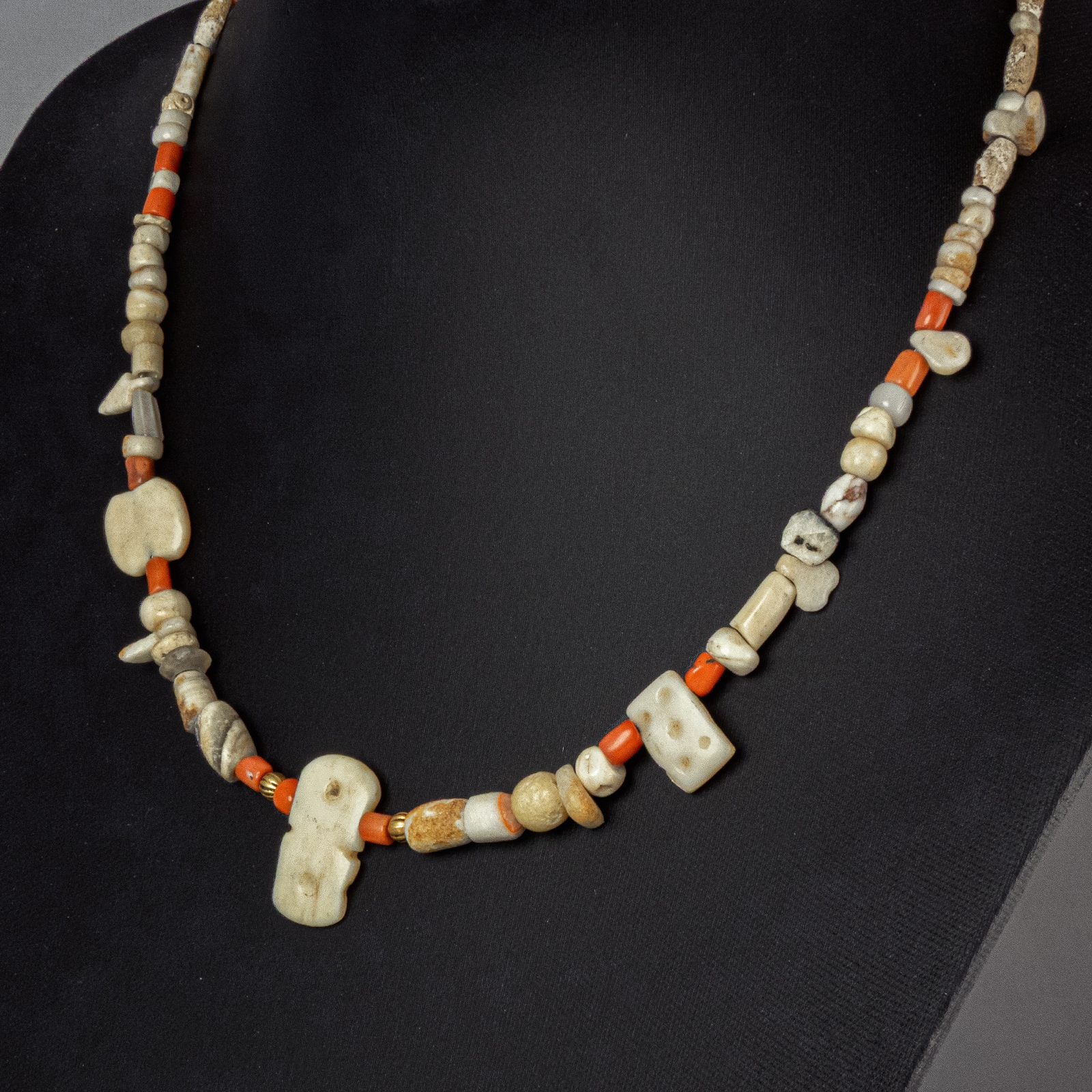 Necklace with ancient stone, shell and coral beads