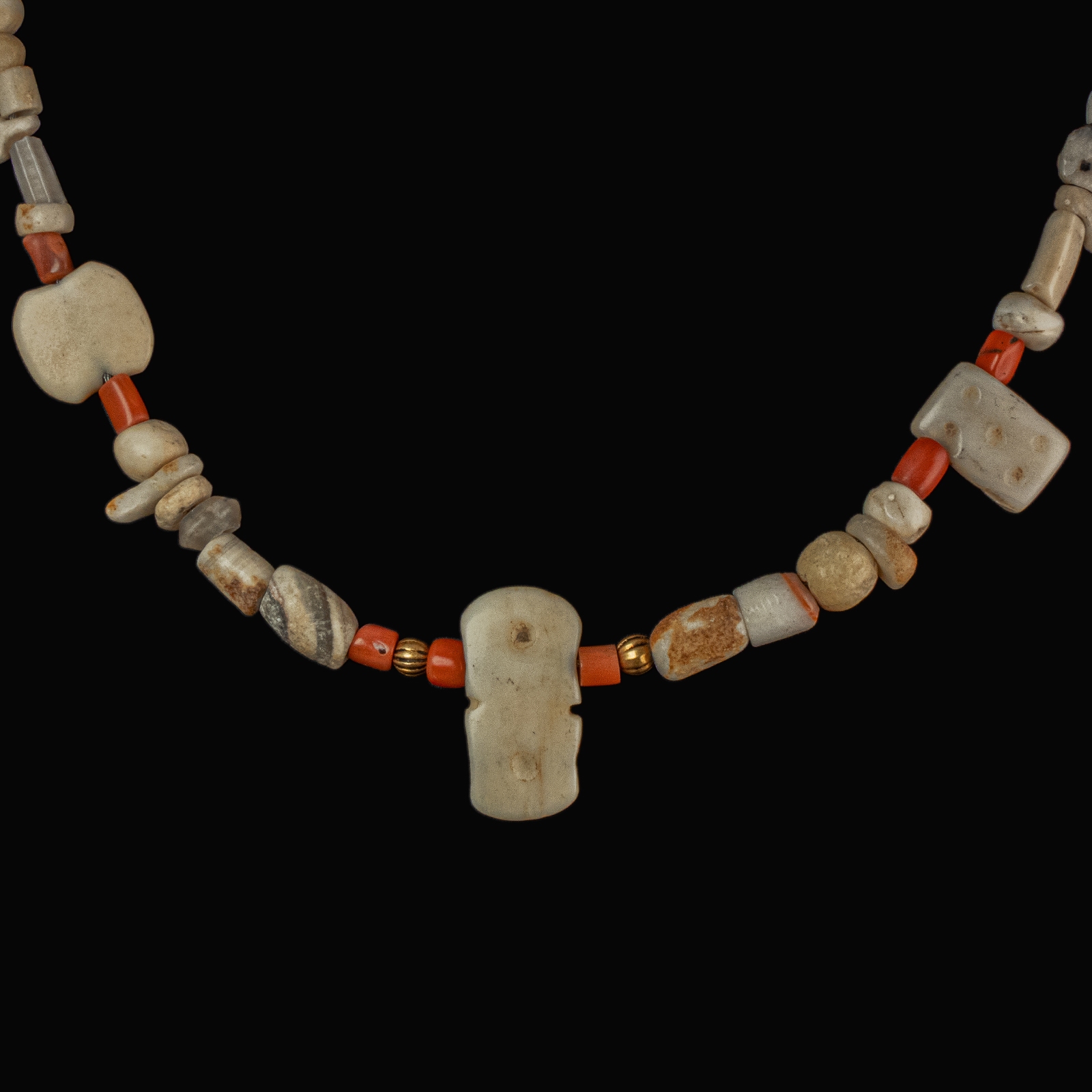 Necklace with ancient stone, shell and coral beads