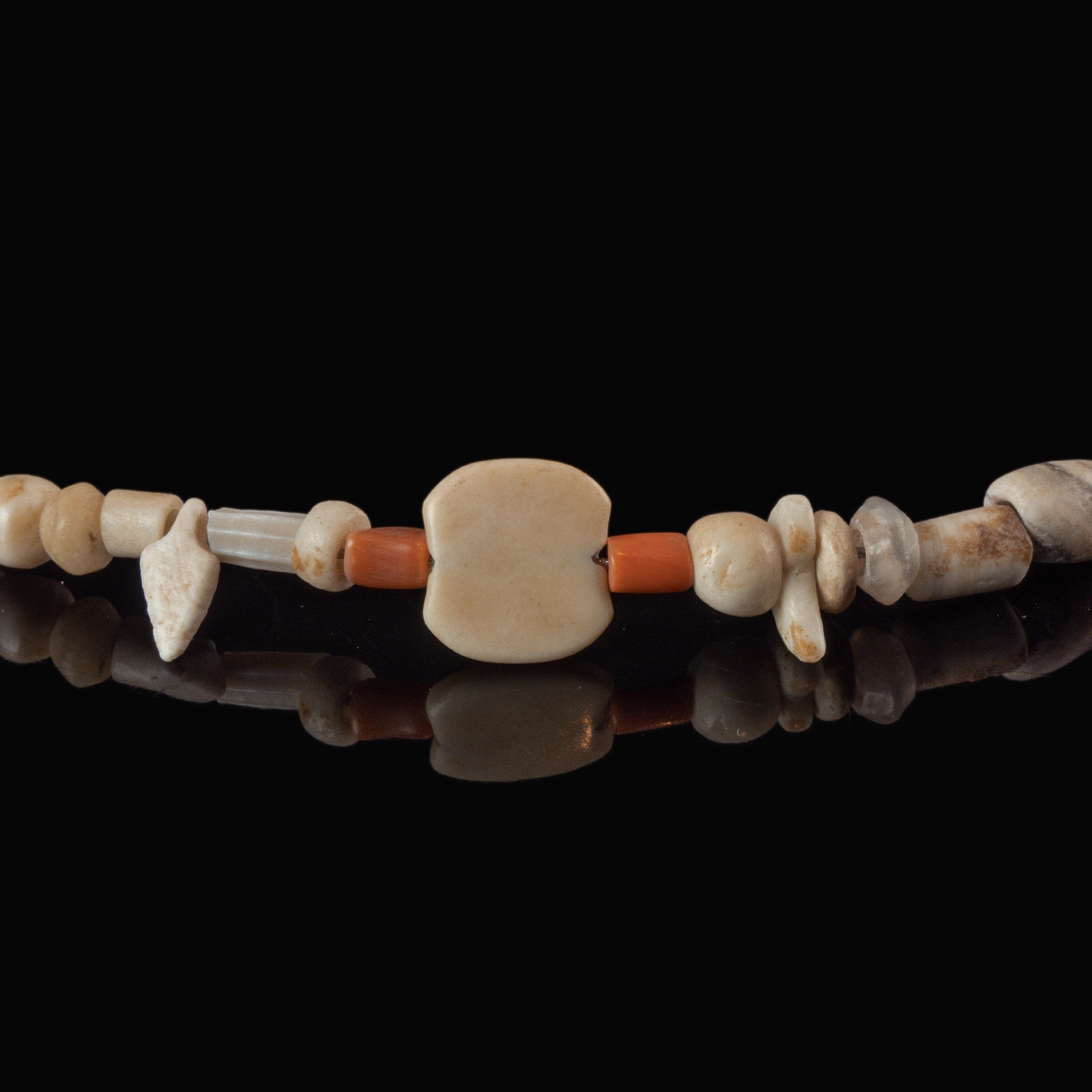 Necklace with ancient stone, shell and coral beads