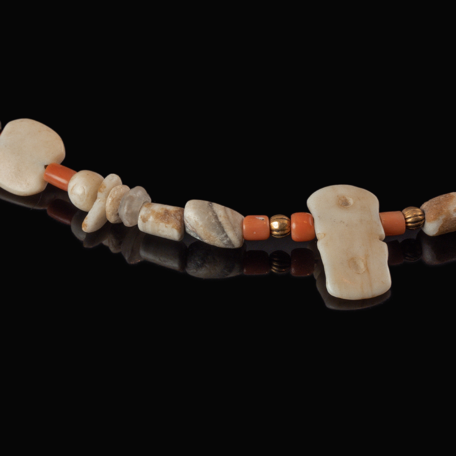 Necklace with ancient stone, shell and coral beads