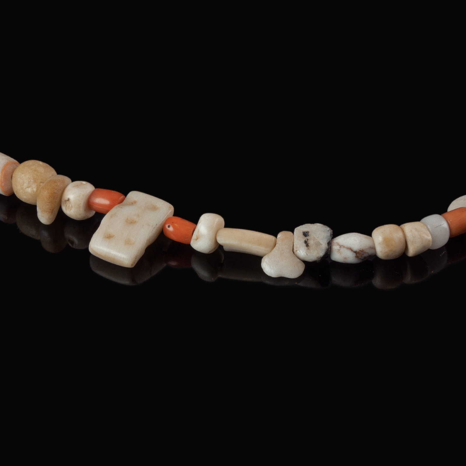 Necklace with ancient stone, shell and coral beads