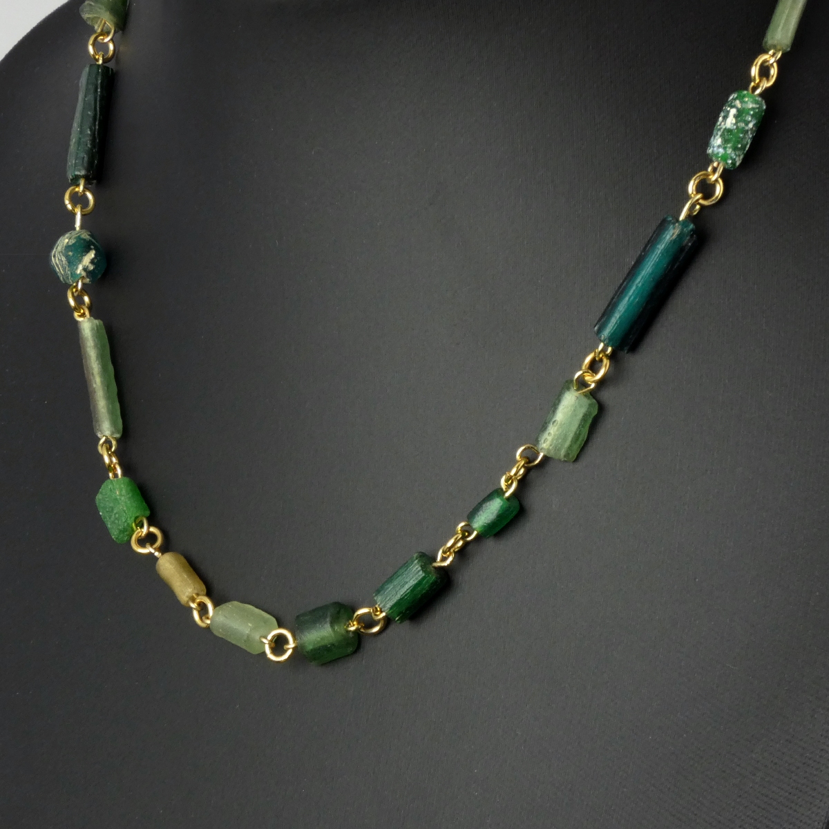 Necklace with Roman green glass beads in a linked design