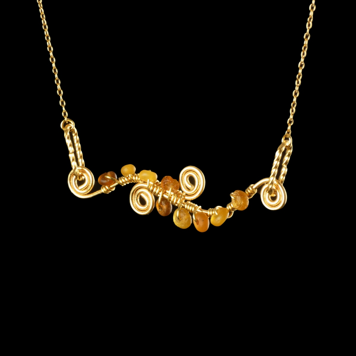 Necklace with wire-wrapped Roman amber glass beads and spiral details