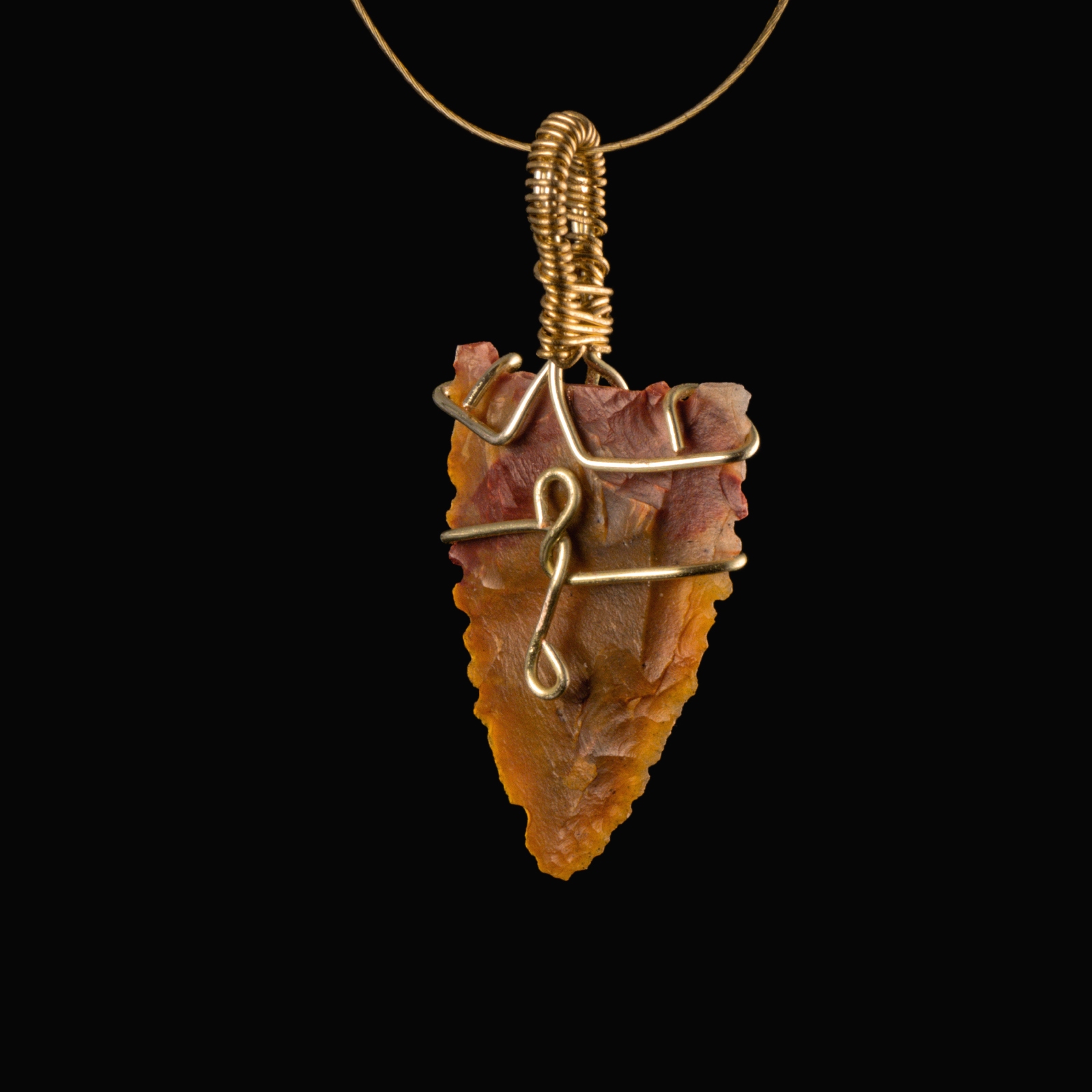 Neolithic wire-wrapped stone arrowhead pendant