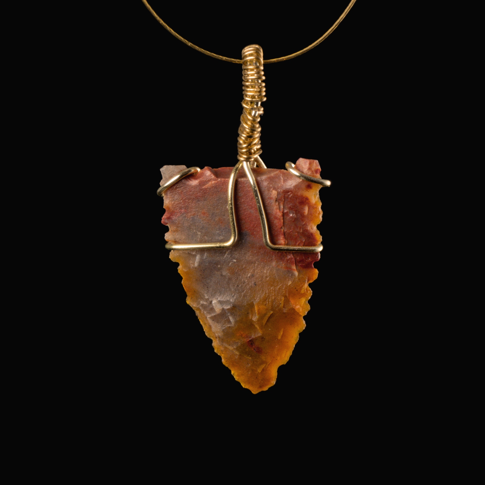 Neolithic wire-wrapped stone arrowhead pendant
