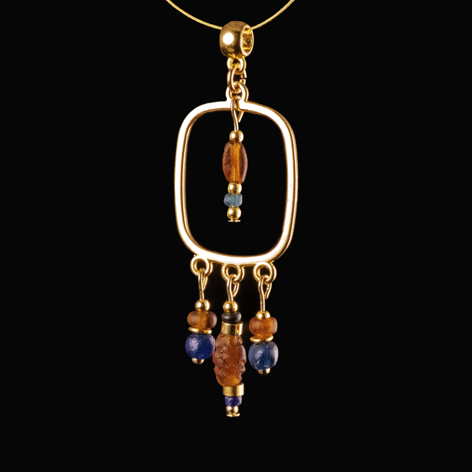 Pendant with Roman blue and amber coloured glass beads