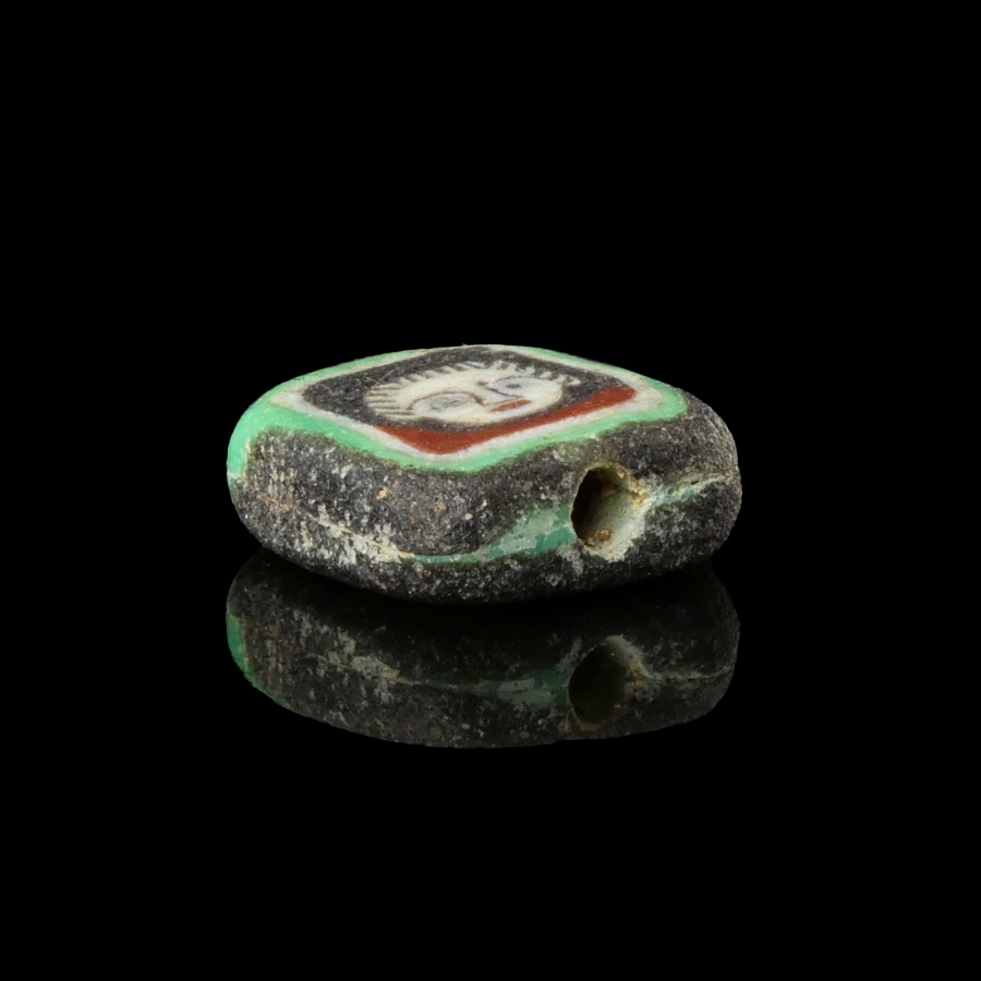 Romano-Egyptian mosaic glass face bead