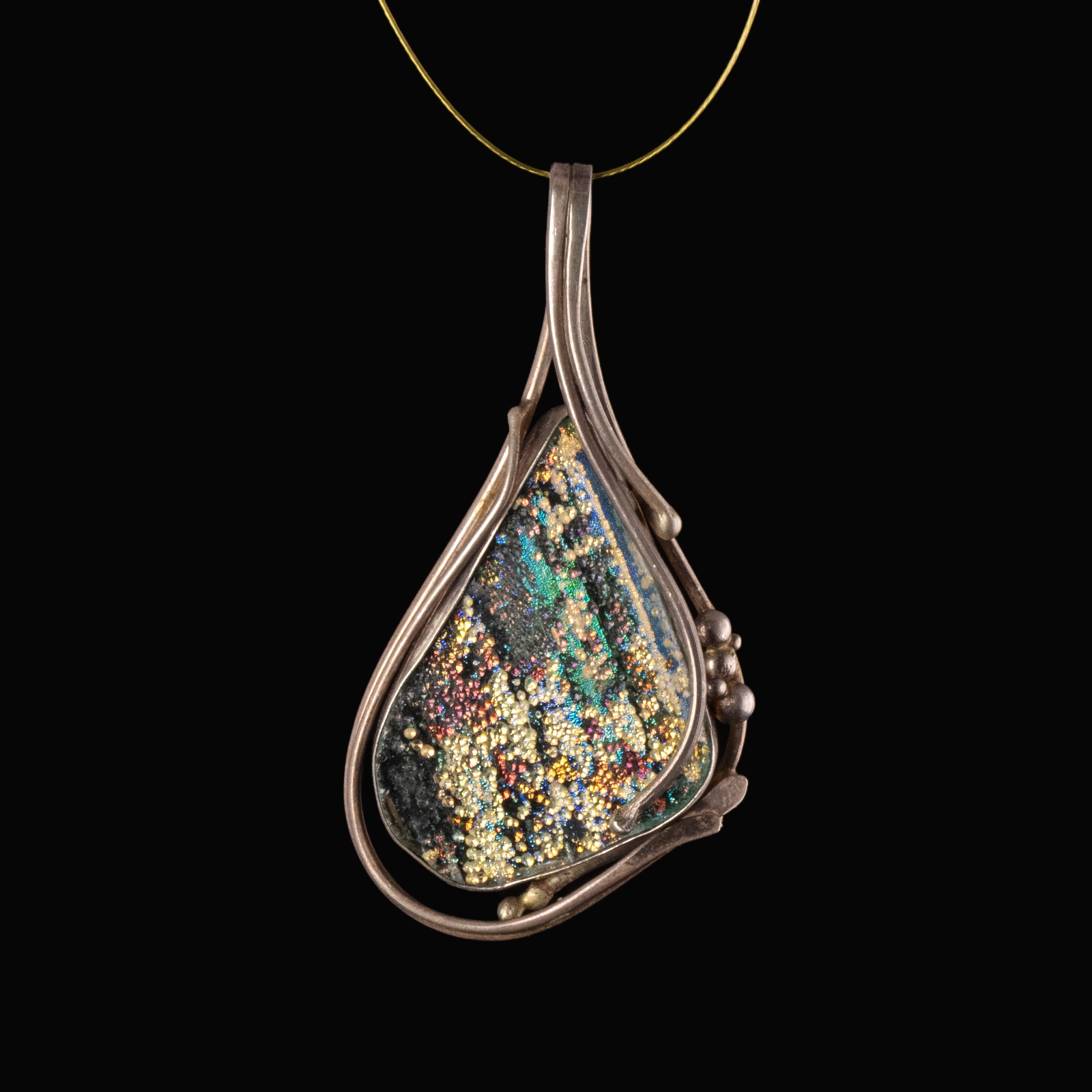 Silver pendant with iridescent Roman glass, custom-designed