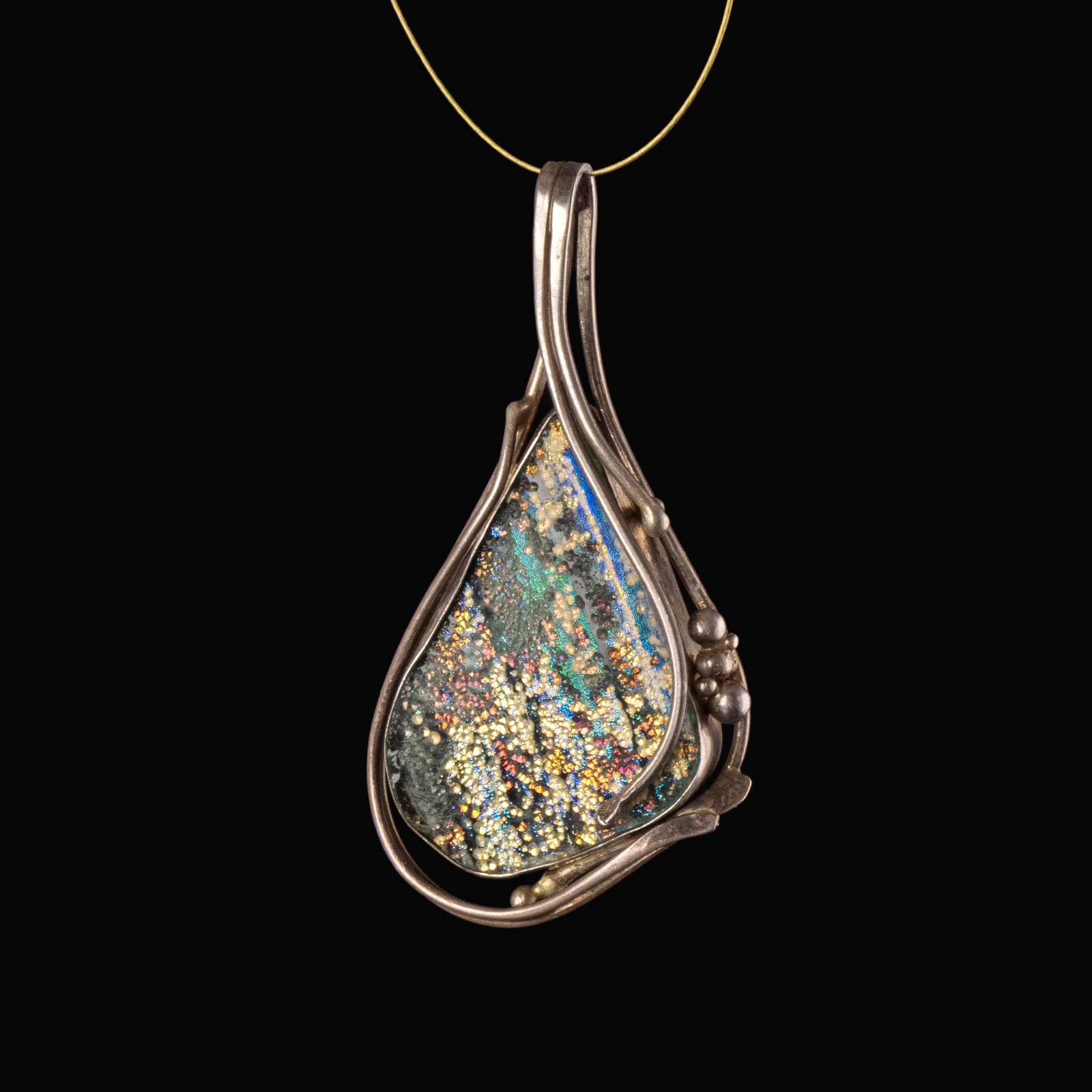 Silver pendant with iridescent Roman glass, custom-designed