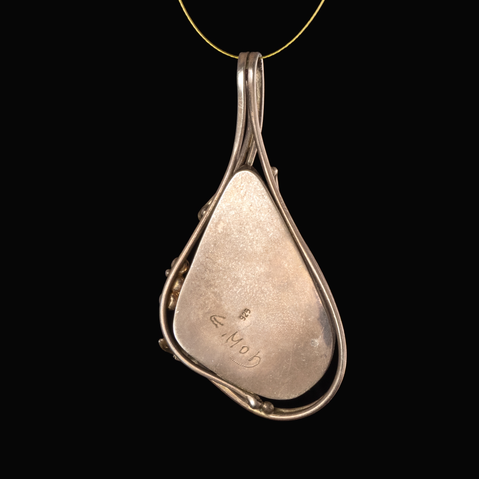 Silver pendant with iridescent Roman glass, custom-designed