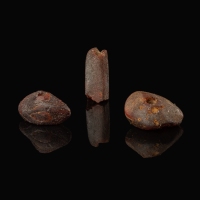 Collection of 3 Roman amber beads in display window