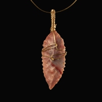 Neolithic wire-wrapped stone arrowhead pendant