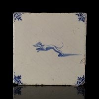Dutch Delft blue and white tile with hunting dog