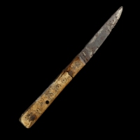Early Medieval iron knife with decorated bone handle