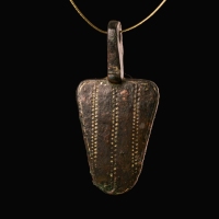 Medieval gilded bronze harness pendant
