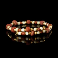 Bracelet with Roman red glass and ancient shell beads in a flexible design