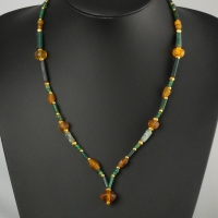 Necklace with Roman green and amber coloured glass beads