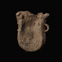 Medieval lead pilgrims ampulla with a crowned crest and a ship