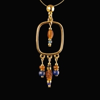 Pendant with Roman blue and amber coloured glass beads