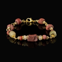 Bracelet with Roman red and semi-translucent glass beads in a linked design