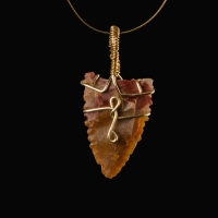 Neolithic wire-wrapped stone arrowhead pendant
