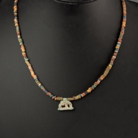 Necklace with ancient Egyptian multicoloured faience beads with a Goddess Nut as a sow amulet