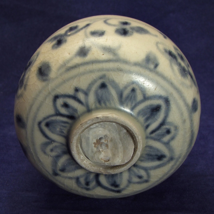 Porcelain blue and white water dropper with ingrown sea shell, recovered from the Hoi An Hoard.